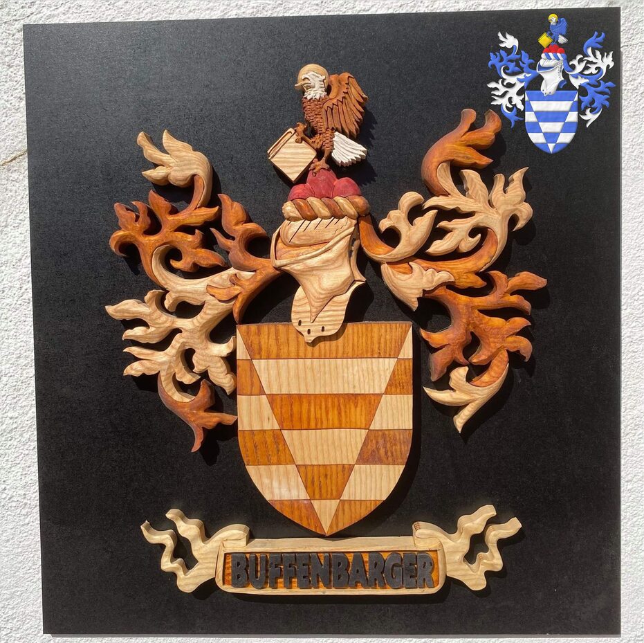Escudo calzado y fajado de plata y azur del uno al otro. Timbrado de un yelmo adornado de dos lambrequines de azur doblados de plata, un burelete de plata y azur, cimado de un monte de tres peas de gules sumado de un guila alzando el vuelo de perfil de azur, cabeza y cola de plata, nimbada y teniendo un libro cerrado ambos de oro. Divisa: Buffenbarger.