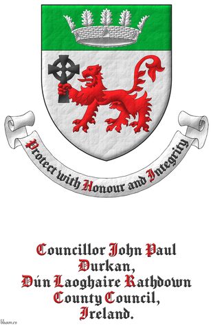 Argent, a lion passant Gules, grasping a Celtic cross Sable in its dexter forepaw, on a chief Vert, a mural crown with five visible oak leaves Argent. Motto: �Protect with Honour and Integrity� Sable, with initial letters Gules, over a scroll Argent.