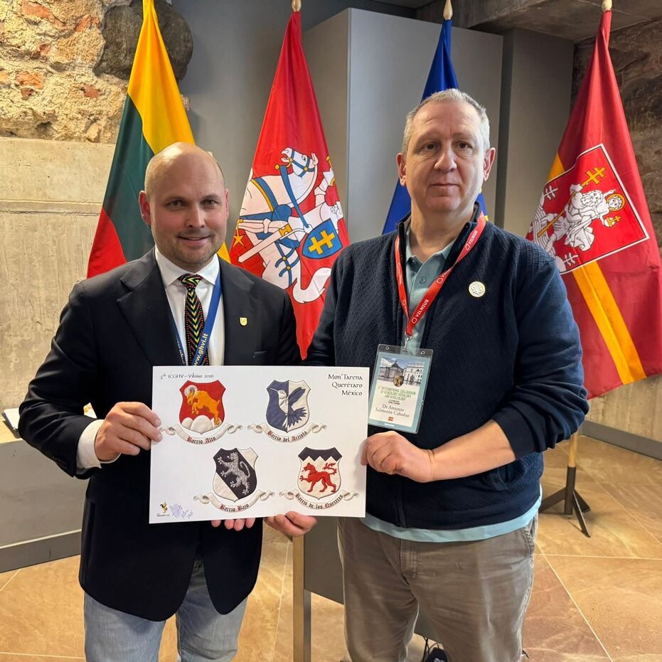 [Gules, on a trimount issuant from the base Argent a bighorn sheep salient Or, horned Argent. Motto: �Barrio Alto� Sable with initial letters Gules over a scroll Argent]; [Party per pale Azure and Argent, a hummingbird volant bendwise counterchanged. Motto: �Barrio del Artista� Sable with initial letters Gules over a scroll Argent]; [Argent, a bend Azure charged with a jaguar rampant Argent, spotted Azure. Motto: �Barrio Bajo� Sable with initial letters Gules over a scroll Argent]; and [Argent, a wolf passant Gules, a chief dancetty Azure. Motto: �Barrio de los Quereres� Sable with initial letters Gules over a scroll Argent].