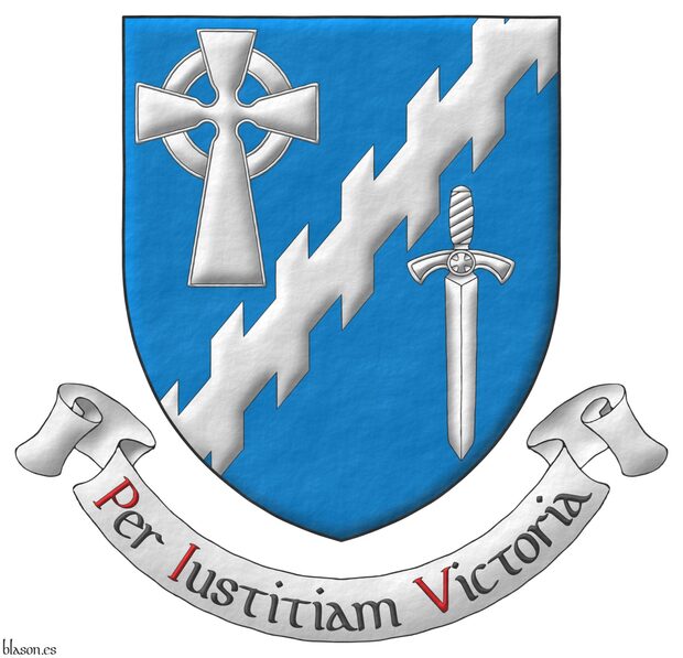 Azure, a bend sinister raguly between, in dexter chief, a Celtic cross, in sinister base, a sword point downwards Argent. Motto: «Per Iustitiam Victoria» Sable, with initial letters Gules, over a scroll Argent.